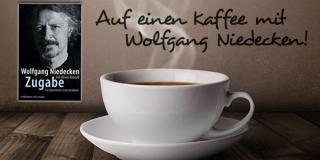 Eine Tasse Kaffee und Hinweis auf die Aktion "Auf einen Kaffee mit Wolfgang Niedecken!"